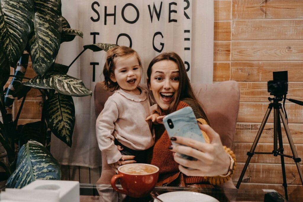 Online jobs for stay-at-home moms. Work From Home women with kids. Blogger girl and her little