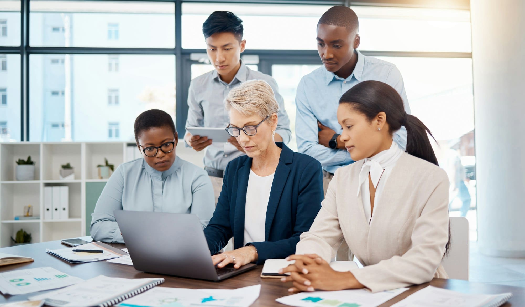 Manager, laptop and collaboration meeting for team working in digital marketing and advertising. Le