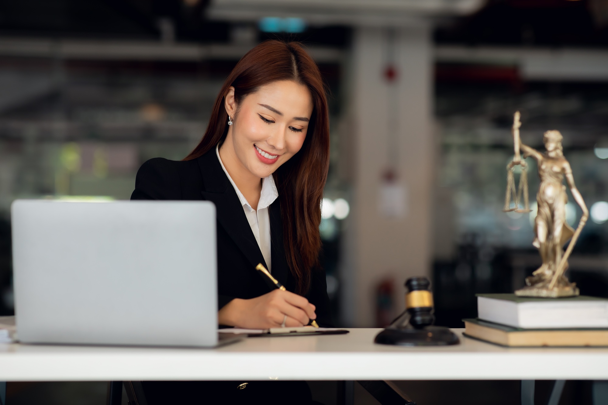 Attractive young lawyer in office Business woman and lawyers discussing contract papers with brass s
