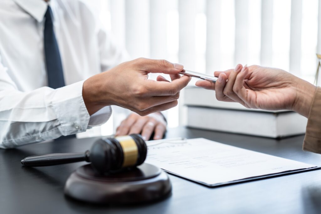 Businesswoman and Male lawyer consult and conference having team meeting with client at law firm