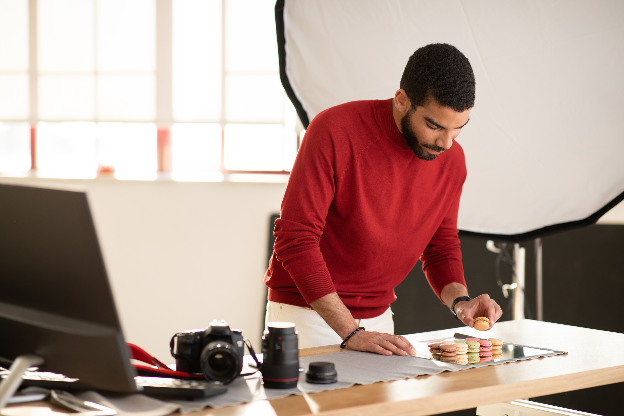 Graphic designer working on food advertisement, taking photo of dessert