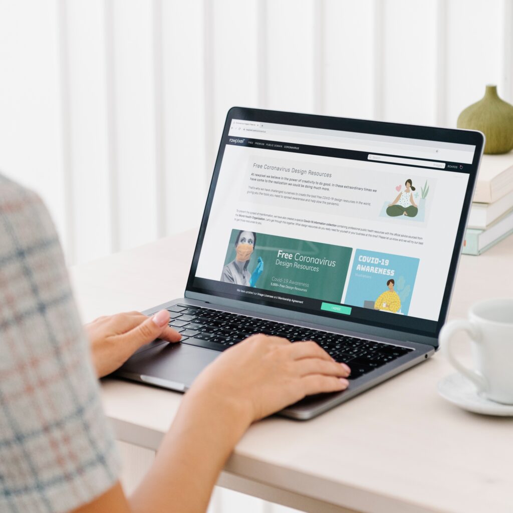 Woman checking out free design resources at a website