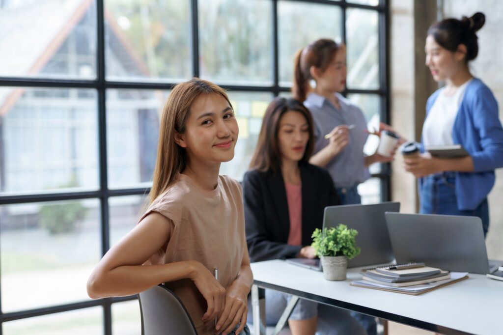 Asian businesswomen are meeting in the office to plan marketing and planning a new system.