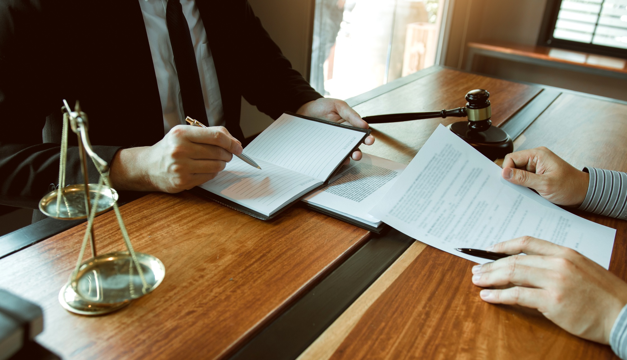 Business lawyer is currently counseling the client's trial at the lawyer office.